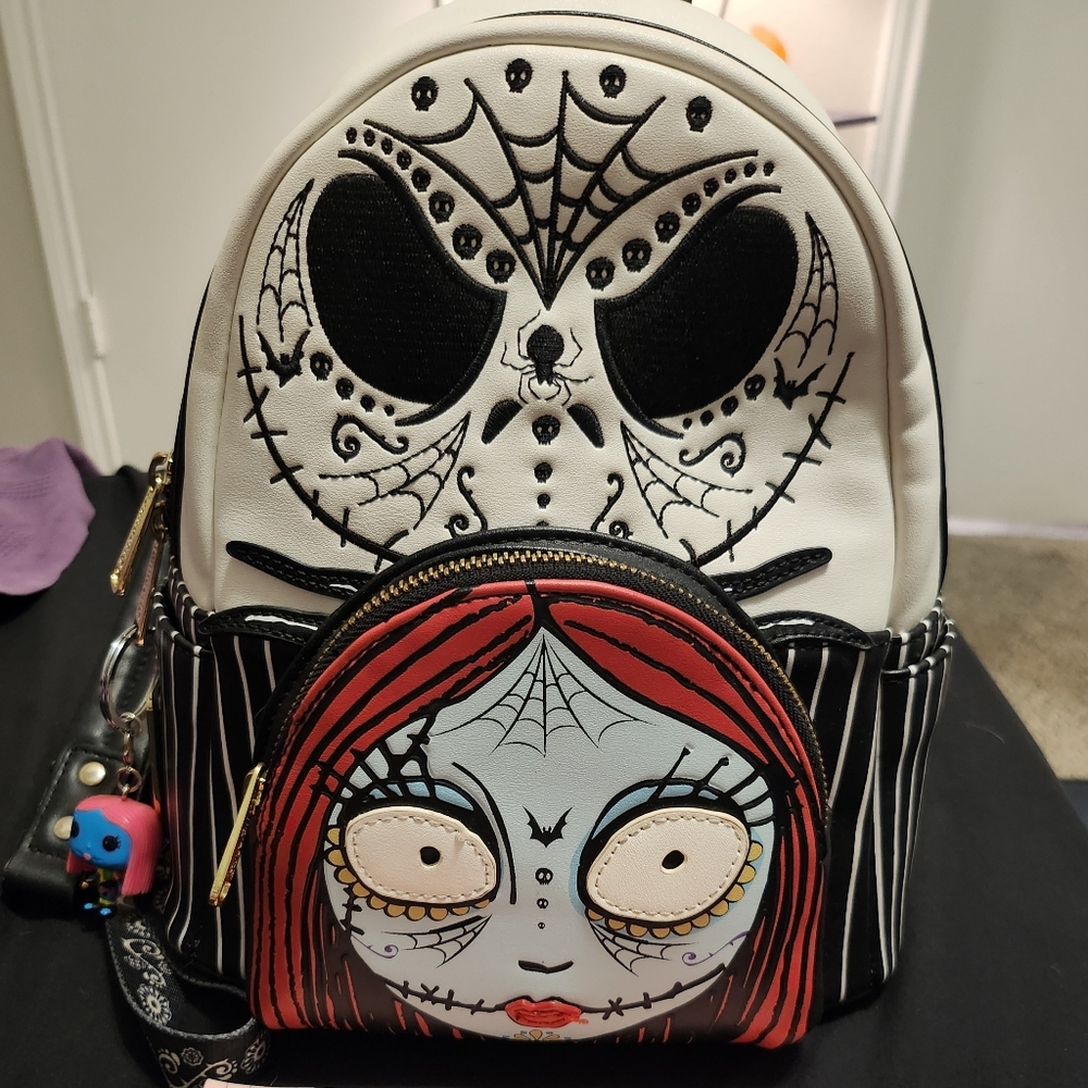 Stylish Black and White Backpack with Red Accents